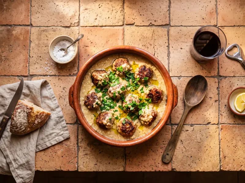 Albóndigas in Almond Sauce — shot from directly overhead, the table surface filling the frame