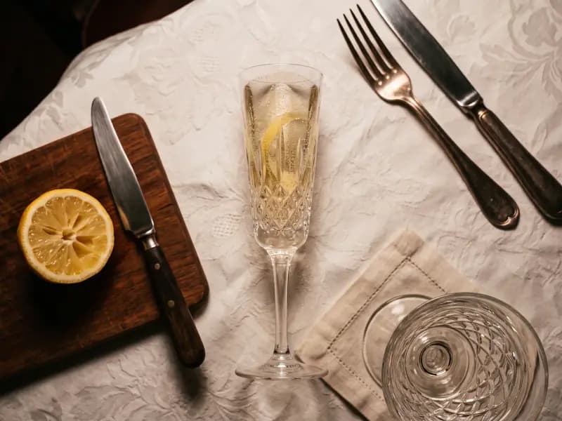 French 75 — shot from directly overhead, the table surface filling the frame