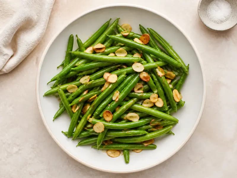 Green Beans with Brown Butter and Almonds — shot from directly overhead: beans blanched hard in salted water and chilled in ice