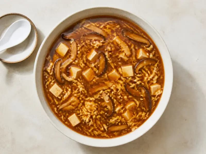 Hot and Sour Soup — shot from directly overhead, the table surface filling the frame
