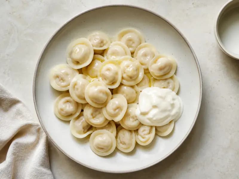 Pelmeni — shot from directly overhead: small meat dumplings in thin dough
