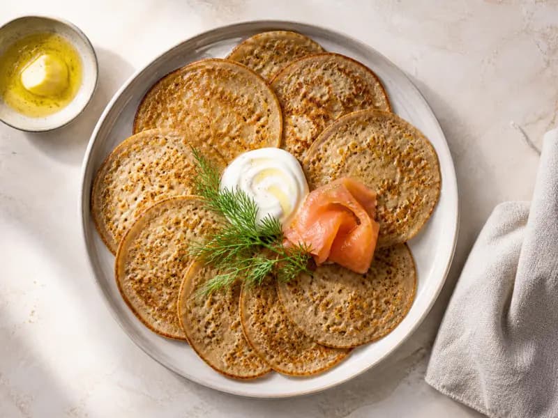 Blini — shot from directly overhead: thin yeasted pancakes of buckwheat and wheat flour