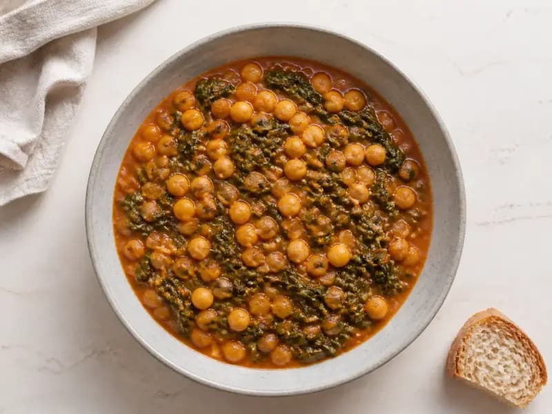 Chickpea and Spinach Stew — shot from directly overhead: dried chickpeas cooked from scratch and thickened with fried bread pounded to a paste