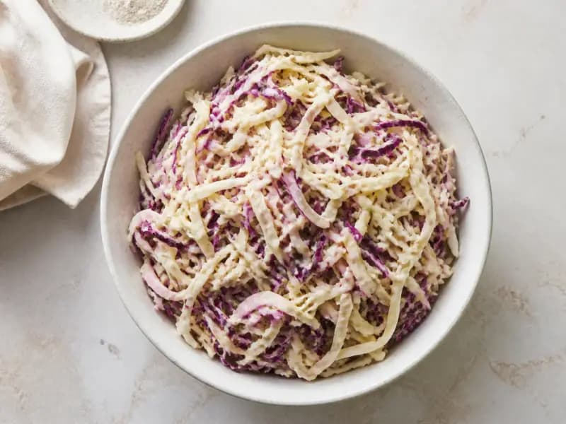 Crunchy Cabbage Slaw — shot from directly overhead: shredded cabbage salted and drained for an hour first