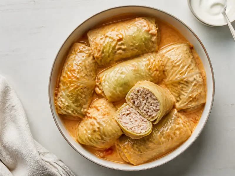 Golubtsy — shot from directly overhead: cabbage leaves rolled around seasoned mince and rice