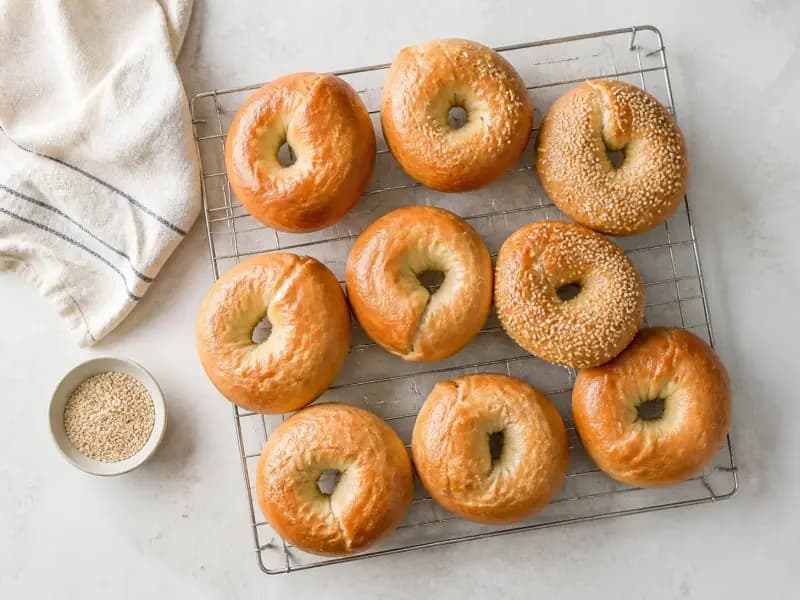 Hand-Rolled Bagels — shot from directly overhead: a stiff low-hydration dough rolled by hand