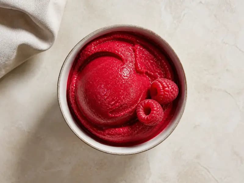 Raspberry Sorbet — shot from directly overhead, the table surface filling the frame