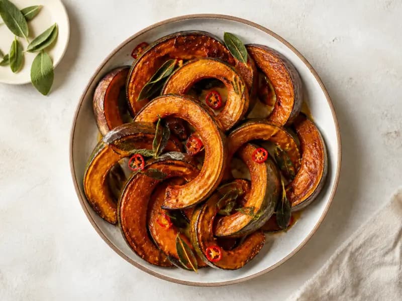 Roast Squash with Sage and Chilli — shot from directly overhead: squash roasted in thick crescents with the skin left on