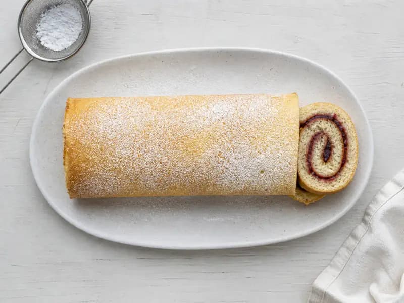 Swiss Roll — shot from directly overhead: a fatless whisked sponge baked in ten minutes and rolled while it is still hot