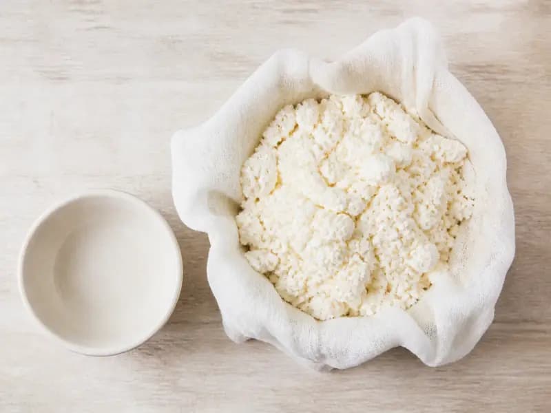 Tvorog — shot from directly overhead: fresh curd cheese drained from gently warmed soured milk